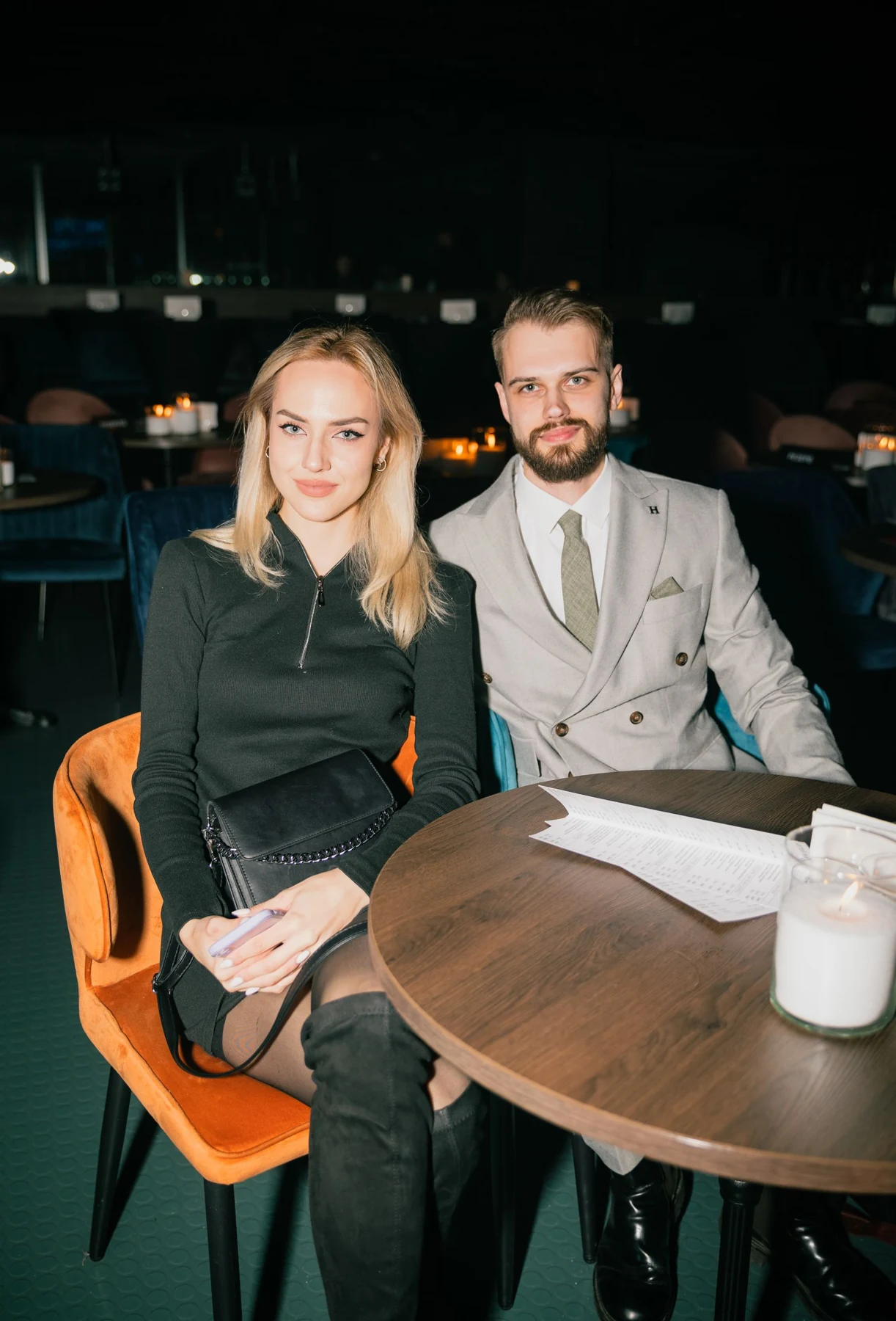 A couple dressed for an evening out at a restaurant