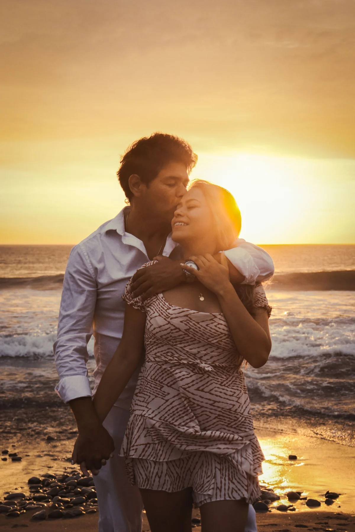 Romantic Couple Embracing at Sunset Beach