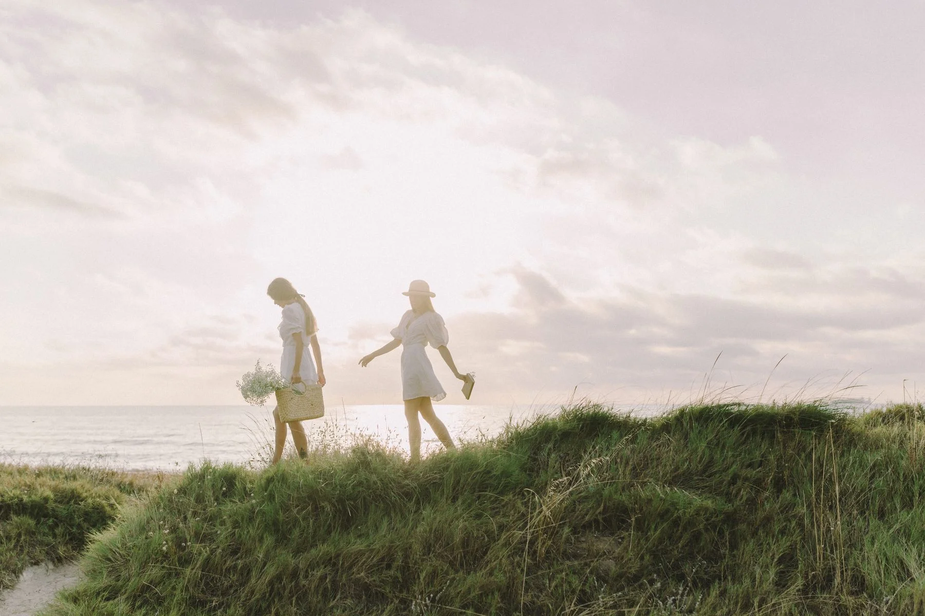 Two women enjoying a walk along the coast
